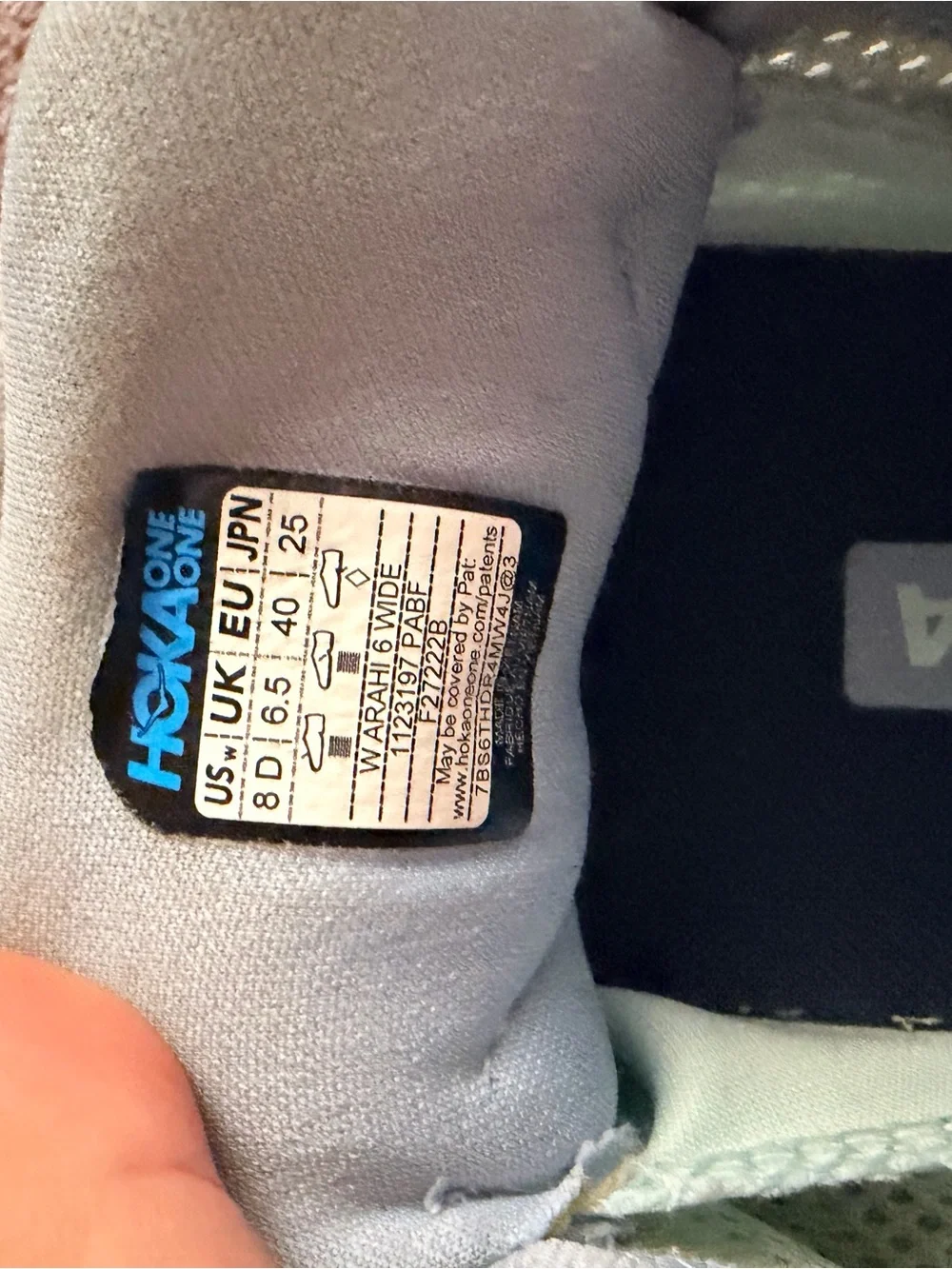 Hoka light gray and yellow running shoes